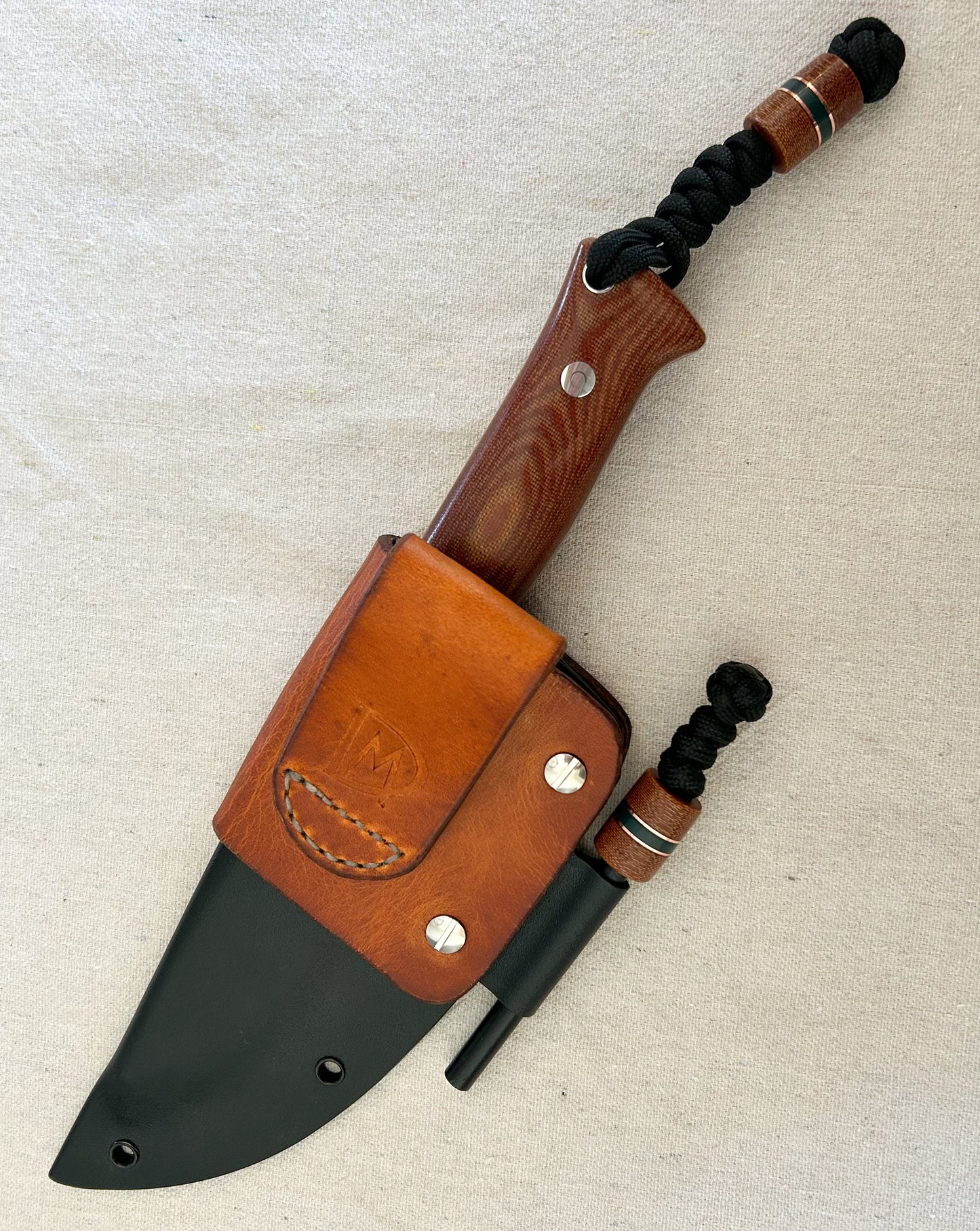 Endure bushcrafter with natural canvas micarta with copper and forest green G10 liners with stainless loveless bolts