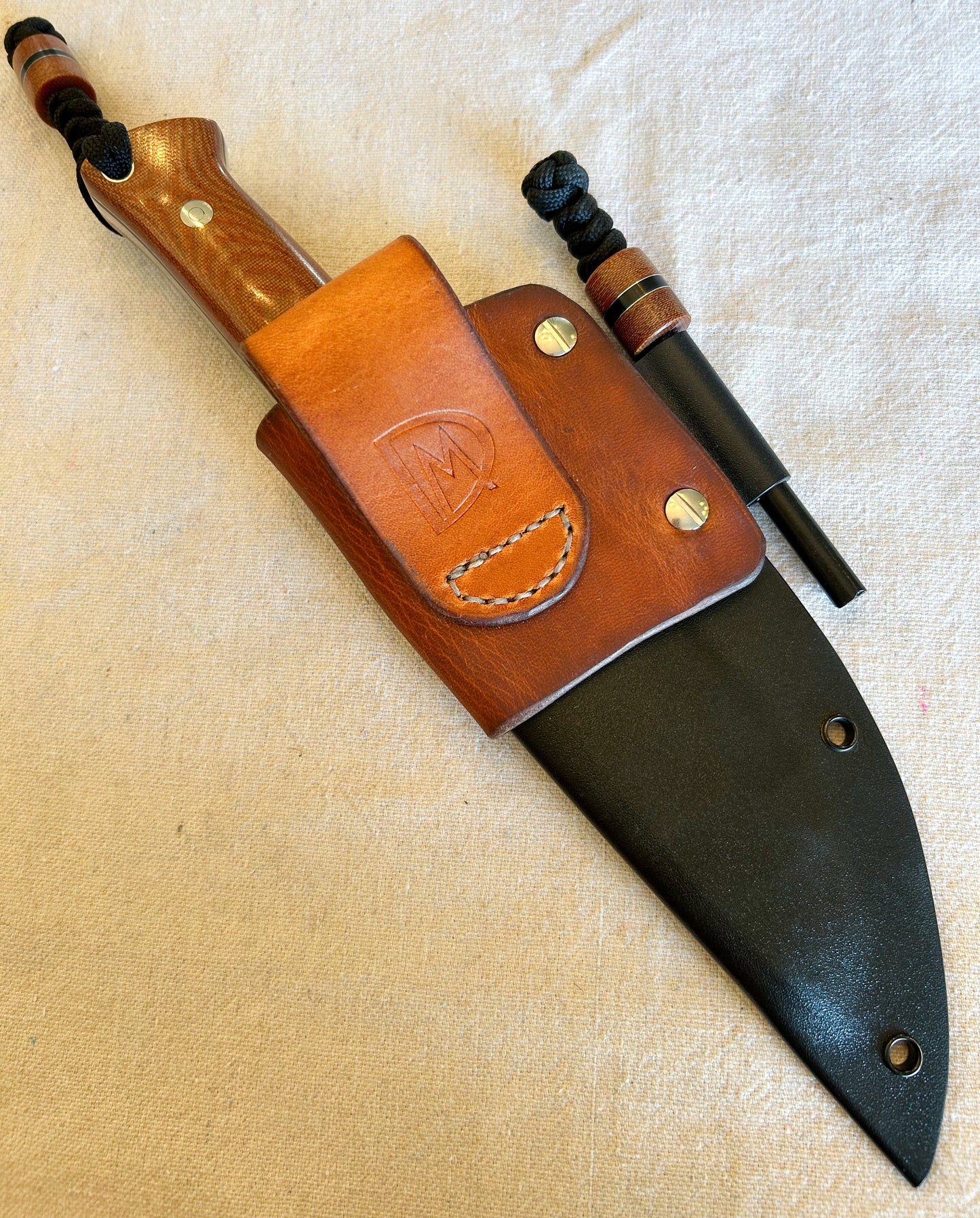 Endure bushcrafter in natural canvas micarta with black G10 and thin aluminum liners