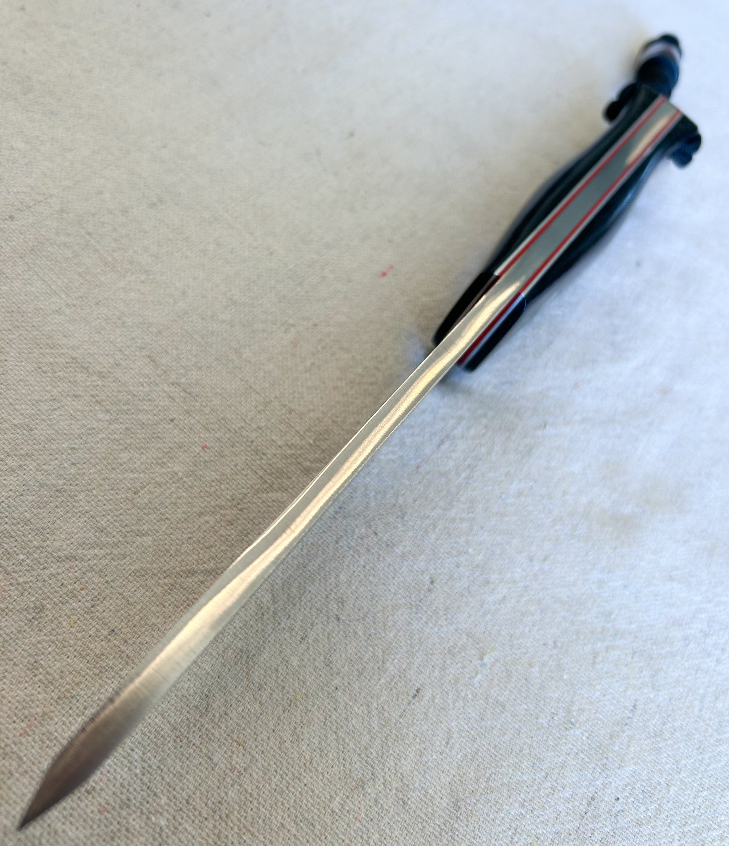 Endure bushcrafter with black canvas micarta with thin red G10 liners