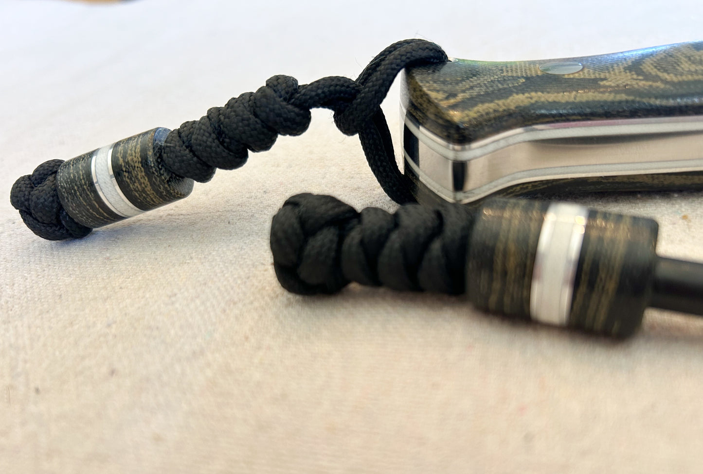 Endure bushcrafter in camo micarta with white G10 and aluminum liners