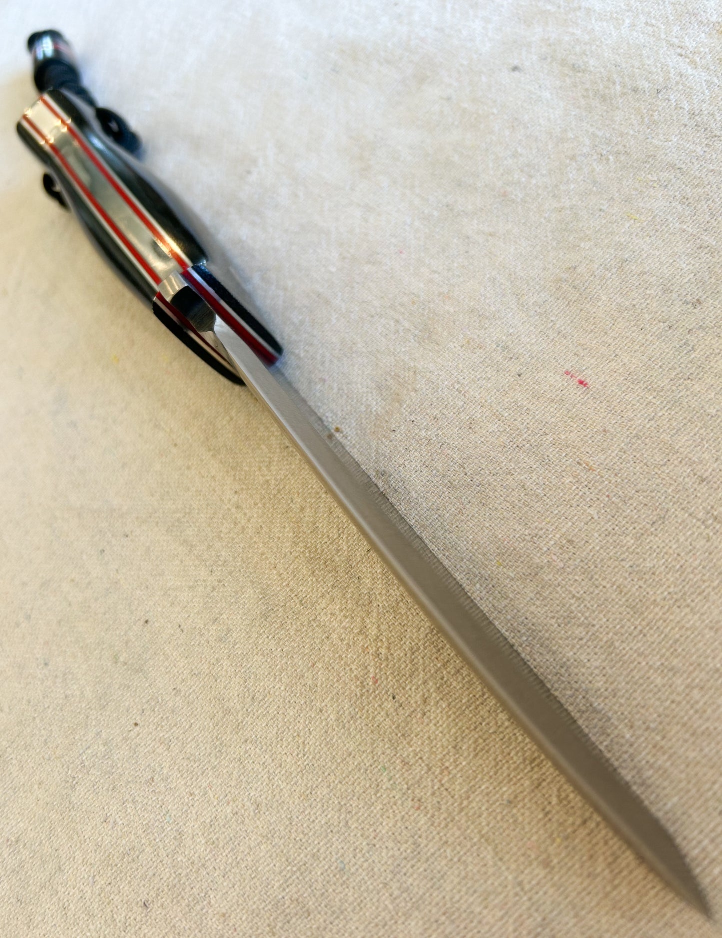 Endure bushcrafter with black canvas micarta and Thick red G10 liners