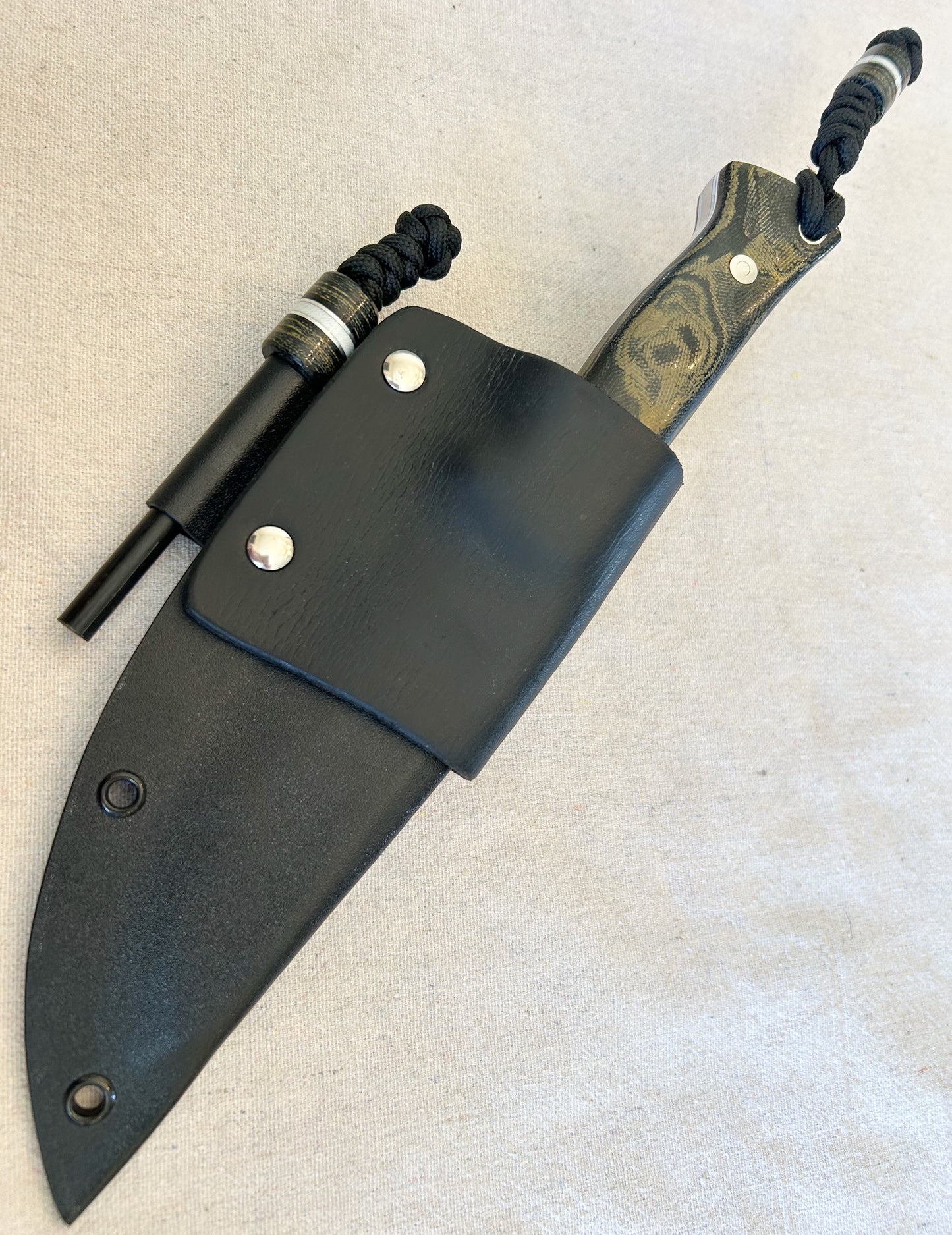 Endure bushcrafter in camo micarta with white G10 and aluminum liners