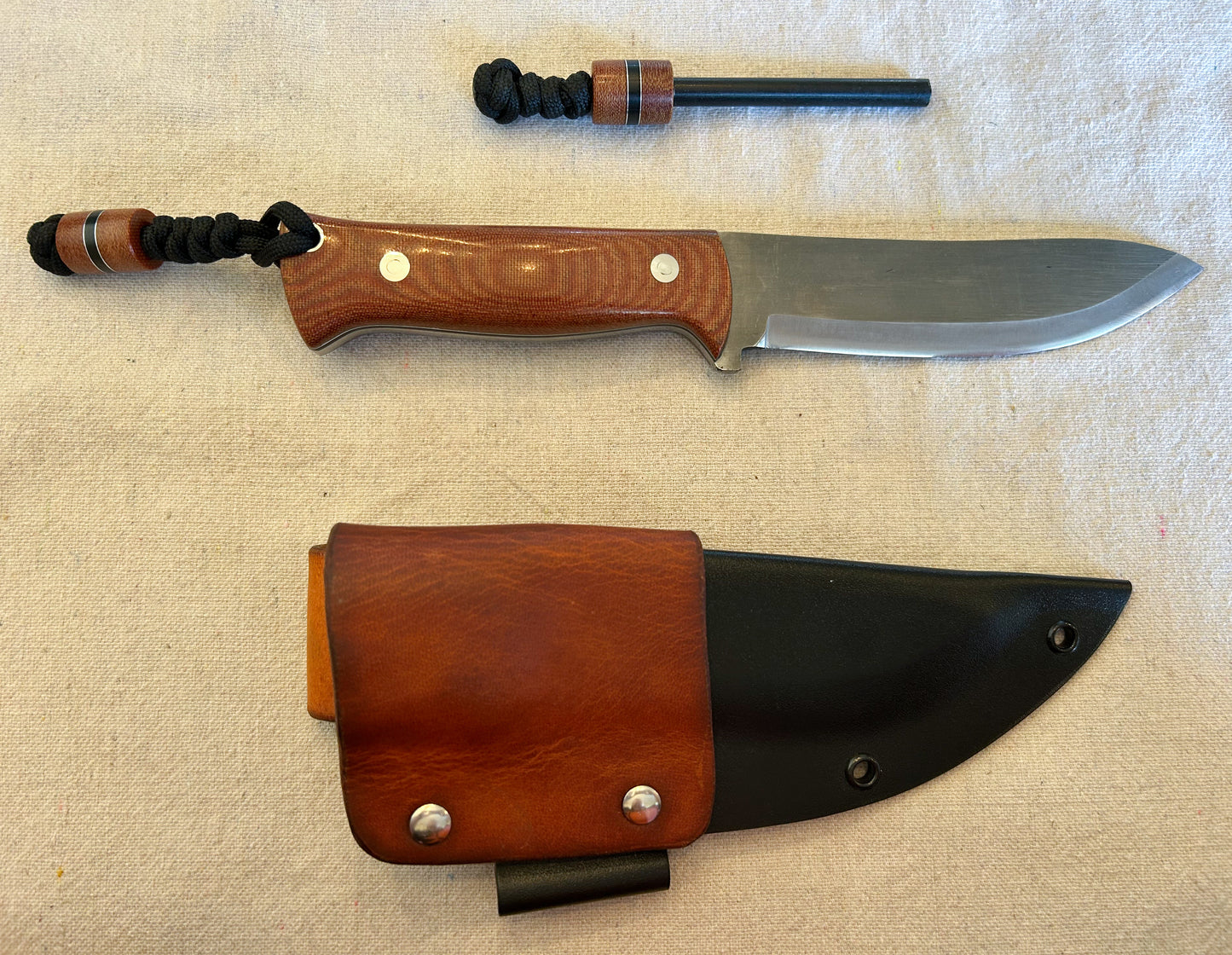 Endure bushcrafter in natural canvas micarta with black G10 and thin aluminum liners