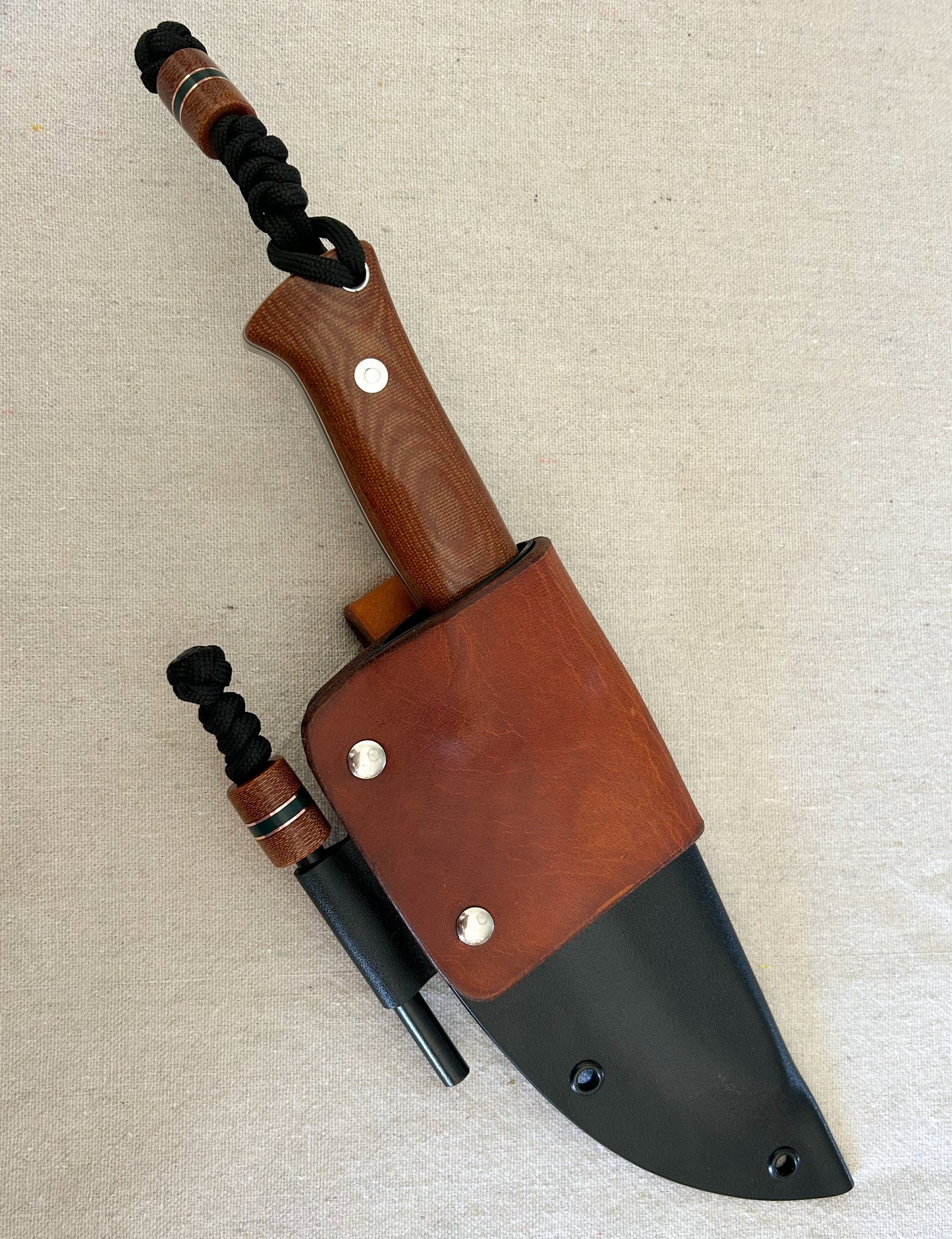 Endure bushcrafter with natural canvas micarta with copper and forest green G10 liners with stainless loveless bolts