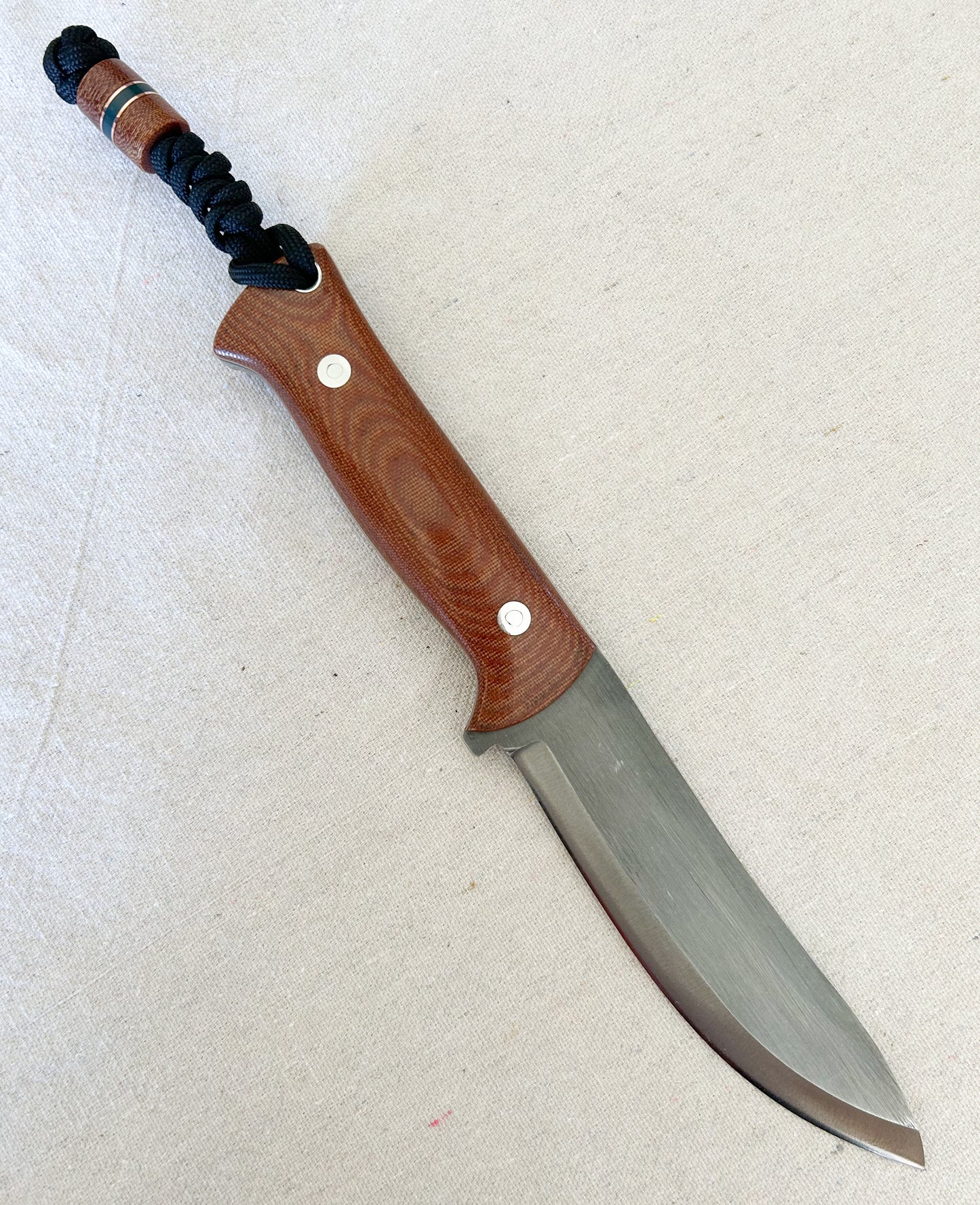 Endure bushcrafter with natural canvas micarta with copper and forest green G10 liners with stainless loveless bolts