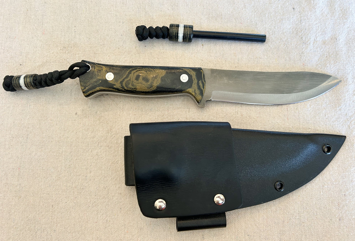 Endure bushcrafter in camo micarta with white G10 and aluminum liners