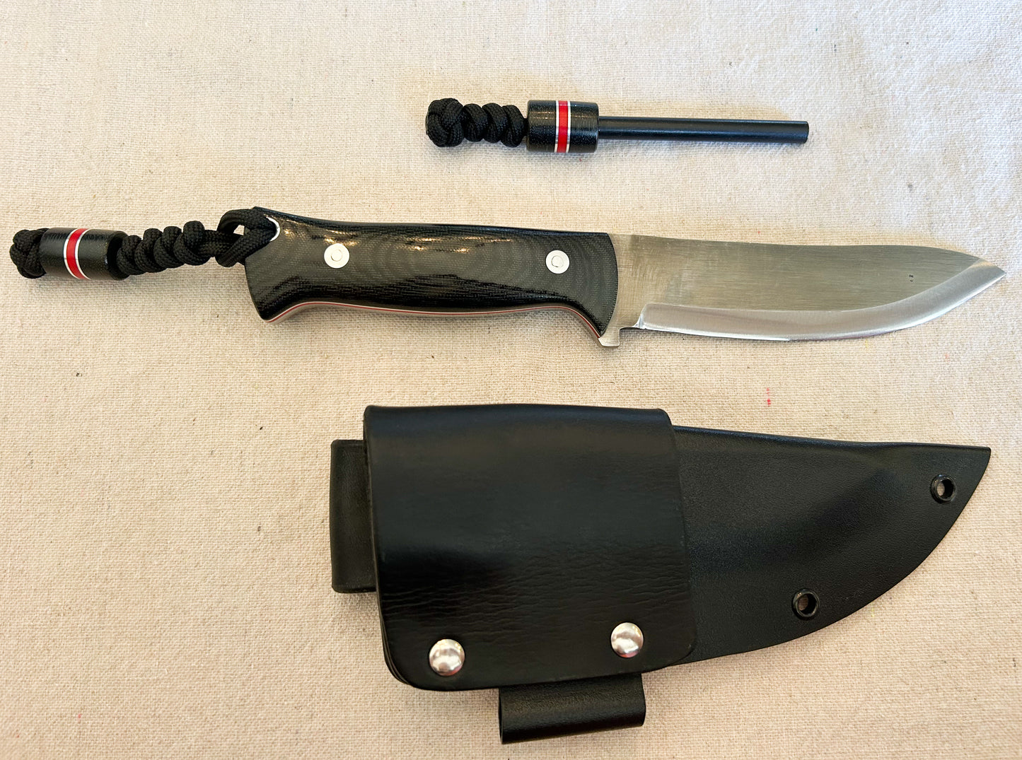 Endure bushcrafter with black canvas micarta and Thick red G10 liners