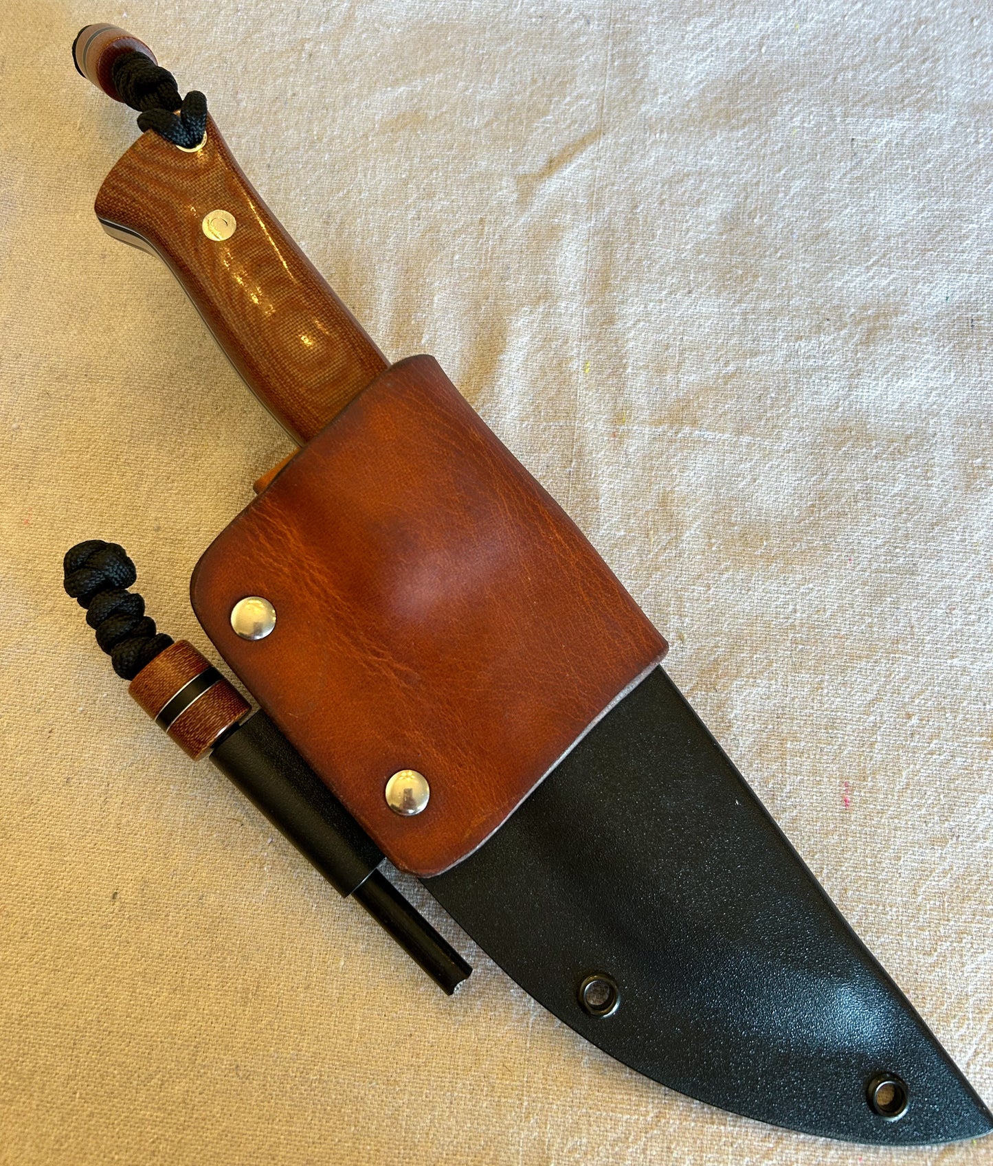Endure bushcrafter in natural canvas micarta with black G10 and thin aluminum liners