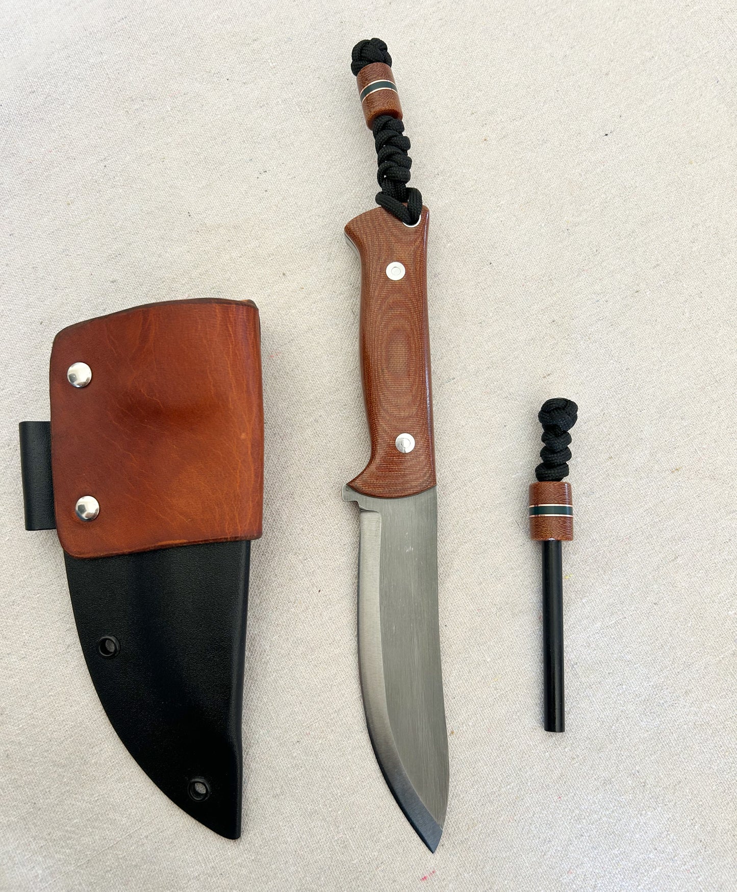 Endure bushcrafter with natural canvas micarta with copper and forest green G10 liners with stainless loveless bolts
