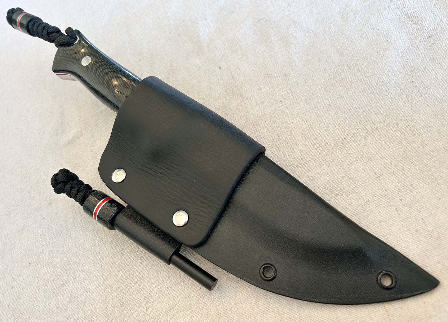 Endure bushcrafter with black canvas micarta with thin red G10 liners