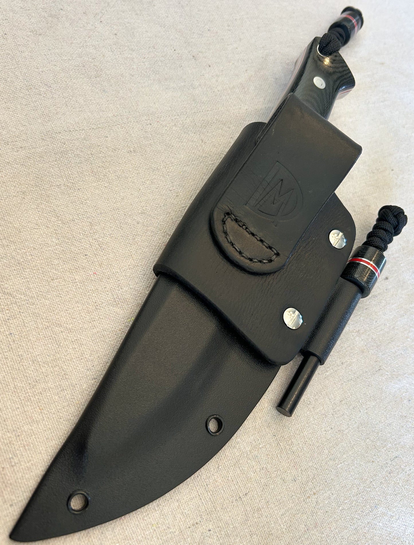 Endure bushcrafter with black canvas micarta with thin red G10 liners