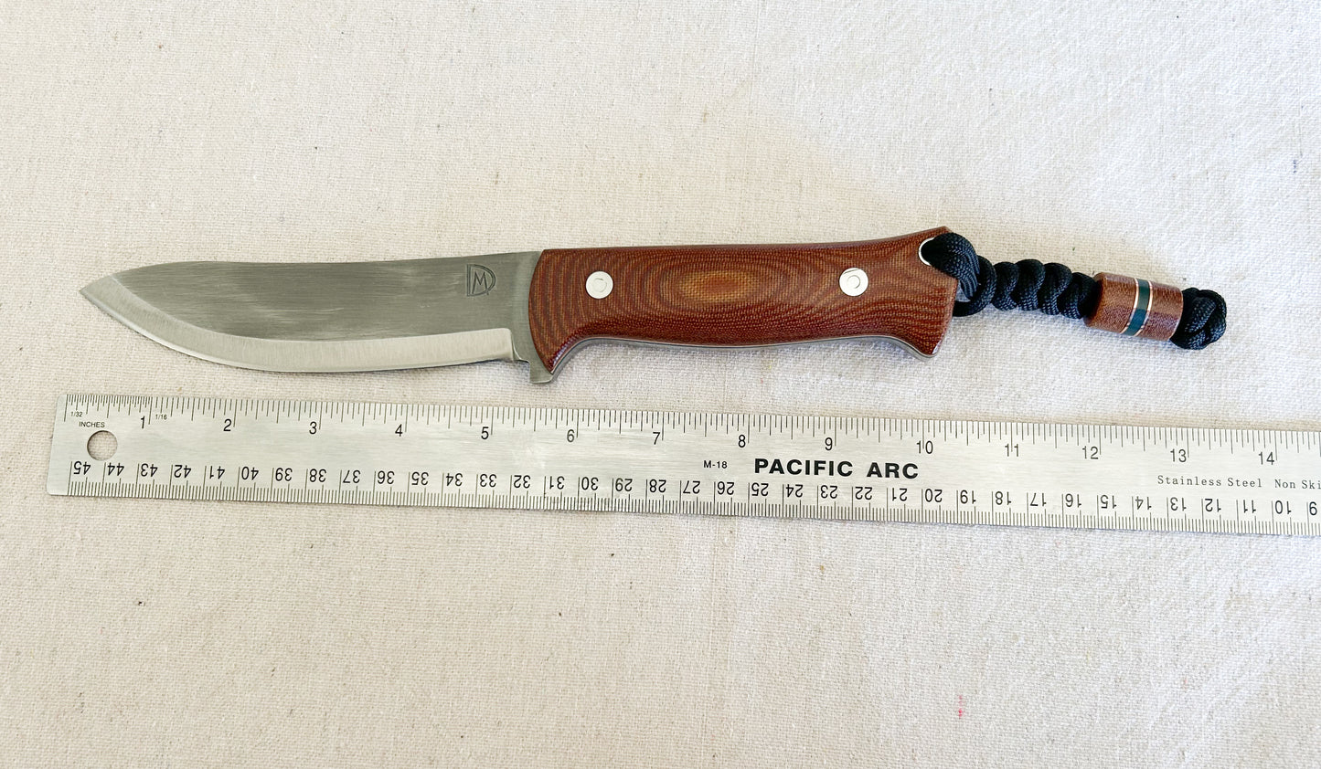 Endure bushcrafter with natural canvas micarta with copper and forest green G10 liners with stainless loveless bolts